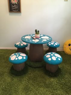 the table and stools are made to look like toad's foot prints on grass