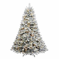 a white christmas tree with snow on it