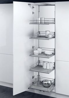 a white cabinet with metal shelves and drawers