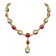 This is part of Chairish’s Fine Jewelry assortment.  Natural Red Ruby 54 Carats South Sea Oval shape Tahiti Pearls Natural Sapphires - 9 Carats 18K Yellow Gold  This Necklace is from the "Baroque" collection and it is the epitome of elegance and versatility and offers a perfect blend for day to night and swimwear to evening wear, allowing you to effortlessly transition between different occasions and outfits. Wearing this will undoubtedly make you the center of attention. It has a rich history g Luxury Red Cabochon Necklace, Luxury Red Cabochon Necklaces, Tahiti Pearl, Victorian Times, Ruby Necklace, Ruby Sapphire, Pearl Set, Red Ruby, Natural Sapphire