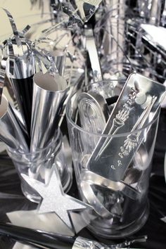 a table topped with silver and black items