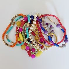 Layered Multicolored Stretchy Bracelets Colorful Beads Wear Together Or Separate Multicolor Wooden Beaded Bracelets, Vibrant Round Beads Bracelets For Beach, Trendy Red Beaded Bracelets With Colorful Beads, Multicolor Wooden Beads Jewelry For Party, Trendy Red Bracelets With Colorful Beads, Beach Red Friendship Bracelets With Colorful Beads, Trendy Red Beaded Bracelets For Festival, Beach-friendly Red Colorful Beads Friendship Bracelets, Multicolor Multi-strand Beaded Bracelets For Beach