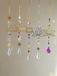 the sun shines brightly in front of an assortment of necklaces hanging from chains