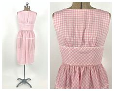 "DETAILS. classic | gathered detail | back v darling 1950's Lanz sundress. vintage pink and white sundress. gingham checked print. buttons at back. empire waist. super soft and lightweight! great vintage condition. this dress is from my private collection. *please note: slight discoloration at underarms -- barely noticeable. ric rac is separating in some spots of hem.* MEASUREMENTS. BUST: 34\" WAIST: 25\" HIPS: free LENGTH: 30\" FABRIC: cotton blend LABEL: Lanz Originals Visit the shop: https:// Vintage Gingham Dresses With Square Neck, 1950s Style Gingham Dress For Picnic, 1950s Plaid Spring Dresses, Retro Gingham Dresses For Daywear, Vintage Gingham Dress For Garden Party, 1950s Plaid Summer Dresses, 1950s Style Plaid Summer Dresses, Vintage Sun Dress, Dress Picnic