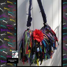 there is a colorful handbag hanging on the wall with words written all over it