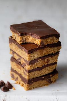 chocolate and peanut butter bars stacked on top of each other