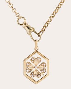 A modern interpretation of vintage love tokens, this 14-karat gold necklace details its hexagonal pendant with diamond-embellished clover motifs. Engraved along the outer edges, 'Je te porterai bonheur'—meaning 'I will bring you luck'—gives nod to 1960's French charms. Clip closure 14k yellow gold and recycled diamond Diamond carat: 0.22 ctw Polish with soft cloth Handmade in the USA Measurements Chain length: 18in Pendant width: 0.47in Pendant length (including bail): 0.96in Yellow Gold Good Luck Pendant Charm Necklaces, Yellow Gold Diamond Amulet Necklace, Clover Pendant Necklace, Yellow Gold Amulet Pendant Charm Necklace, Clover Pendant, Vintage Clover, Love Token, Clover Charm, Women Diamond