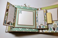 an open scrapbook with papers and pictures on it