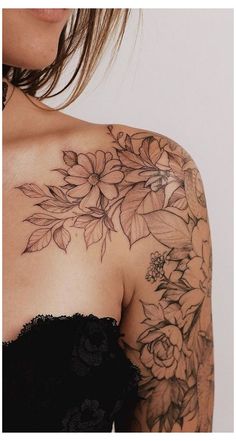 a woman with tattoos on her arm and shoulder