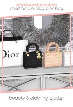 three bags sitting on top of a white dresser next to a mirror with the words dior