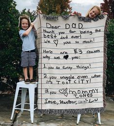 two children standing next to a sign that says dear dad