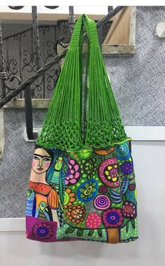 a colorful bag hanging from the side of a stair case