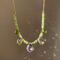 💎Stylish, delicate yet gorgeous Green Peridot gemstone beaded necklace💎 🍀 Approximately 3.75mm Natural Green Peridot Faceted Rondelles and 15mm x 10mm Pink Amethyst & 10mm~ 11mm X 7.5mm~8mm Lemon Quartz Kite Shaped Faceted Gemstone and 7.5mm x 5mm Green Peridot Teardrop Faceted Briolette. 🍀  Material and Chain : 14K Gold Filled wire / Satellite Chain and Beading Wire 🍀Necklace size : Approx. 18 inches / 45.5cm long  🍀 All materials are High Quality 14K Gold Filled, Nickel FREE, suitable fo Peridot Briolette Gemstone Jewelry, Green Briolette Necklace In Fine Jewelry Style, Green Briolette Necklace Fine Jewelry, Delicate Briolette Gemstone Beads Jewelry, Elegant Briolette Crystal Healing Necklace, Fine Jewelry Green Amethyst, Green Amethyst Fine Jewelry, Faceted Round Bead Necklaces For May Birthstone, Elegant Beaded Necklace With May Birthstone