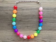 "Simply Gorgeous!! Colorful beaded necklace in rainbow colors. These beads have a bubblegum shape and size and are jelly acrylic. Silver finishing. 16\" Necklace with a 4\" extender chain. Thank you for supporting American small and handmade business! Check out our other items: Www.PolkaDotDrawer.Etsy.com" Bean Necklace, Colorful Beaded Necklace, Jewelry Chunky, 16 Necklace, Necklace Colorful, Chunky Statement Necklace, Business Check, Rainbow Jewelry, Jelly Bean