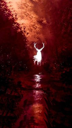 a deer standing in the middle of a forest at night with red light coming from its antlers