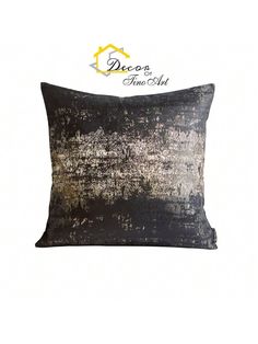 a black and silver pillow with gold foil on the front, along with a white background