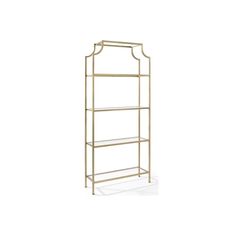 a gold metal shelf with three shelves