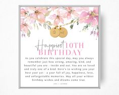 a birthday card with pink flowers and two gold tags