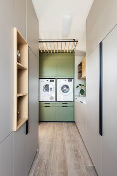 the laundry room is clean and ready to be used as a washer and dryer