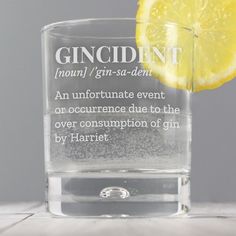 a glass filled with water and a slice of lemon