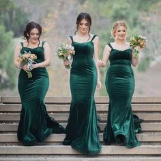 the bridesmaids are wearing green dresses and holding bouquets in their hands as they walk down the stairs