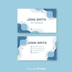 two business cards with blue and white shapes on the front, one is for art director