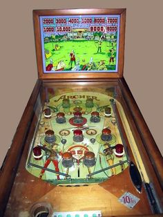 an old fashioned pinball machine with lots of buttons