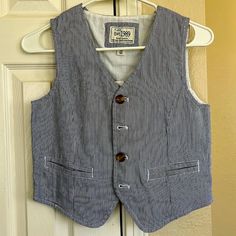 Brand New Boys Size 10 Blue And White Pin-Striped Button Down Vest. Cotton Button-up Vest, Cotton Button-up Vest With Buttons, Casual Cotton Vest With Snap Buttons, Spring Cotton Vest With Buttons, Blue Button-up Cotton Vest, Blue Cotton Vest With Buttons, Casual School Outerwear With Buttons, Blue Button-up Vest With Buttons, Fitted Cotton Outerwear For School