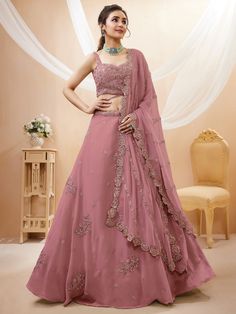 Upgrade your ethnic wardrobe with this stunning designer dusty pink sequin georgette party wear lehenga choli. Crafted with meticulous attention to detail, this ensemble exudes elegance and charm, making it perfect for receptions, weddings, and parties.
The lehenga features a beautiful dusty pink color, which is complemented by intricate dori work, glitter sequin work, and embroidery work. The georgette material adds a touch of luxury and grace to the outfit. With a semi-stitched design and a 3. Linen Lehenga, Simple Lehenga Designs Classy, Designer Dupatta, Dori Work, Georgette Material, Simple Lehenga, Choli Dress, Indian Lehenga Choli, Outfits Indian