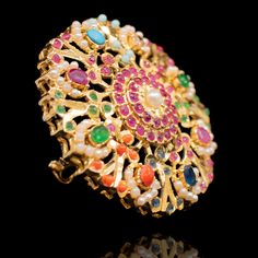 Adorn in the colors of nauratan accessories and beautify your hands with our Visha Ring! Paint a splash of colors in your festive attire with beautiful ring embellished with majestic stones. This ring can be paired with any of the ornaments from our Nauratan Essentials. Gold-plated on high-quality brass as base metal. Made by order. Kindly allow 5-7 weeks for the delivery of this item. For custom or urgent requests, please contact support@alacouture.com. *Please Note: We use faux stones and bead Multicolor Jeweled Ring, Elegant Multicolor Toe Ring Jewelry, Bohemian Multi-stone Wedding Rings, Bohemian Multicolor Rings For Wedding, Fusion Style Multicolor Wedding Rings, Festive Multicolor Toe Ring Jewelry, Festive Multicolor Toe Ring, Traditional Multicolor Rings For Gifts, Traditional Multicolor Rings As Gift