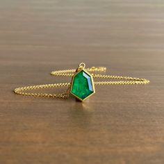 Stately in color and form, this magnificent emerald pendant is set in opulent yellow gold.

22k, 18k yellow gold 
Emerald, 3.95 carats, 10mm x 15mm (7/16" x 5/8")
1.5mm cable chain is adjustable and can be worn at 17" or 20" Emerald Pendant, Jewellery Ideas, Cable Chain, Gold Jewelry