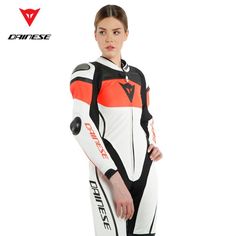 The Dainese leather suit. Designed to meet all racing needs. Imatra combines all the iconic Dainese racing features in a cowhide full grain leather suit designed specifically for women. Its design guarantees perfect fit and ergonomics during races. Dainese Tri-Axial exclusive system on the back and three-way stretch leather inserts allow for great freedom of movement while guaranteeing the same level of abrasion resistance as the other leather layers. Motorcycle Suit Women, Lady Suit, Arrow Fabric, Golden Time, Leather Suit, Motorcycle Suit, New Motorcycles, Motorcycle Style, Lady Biker