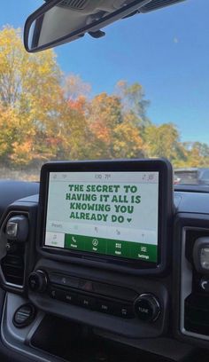 a car dashboard with a sign on it that says the secret to keeping kids safe is coming you already do't