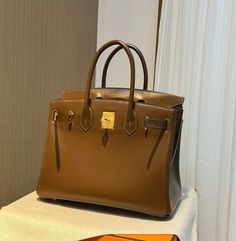 Size: Standard Size It comes with Dust box, Care manual, Tag, and Paper bag. High-end Tan Satchel Bag, Brown Light Luxury Tote Bag, Light Luxury Brown Tote Bag, High-end Brown Bags For Shopping, High-end Brown Shopping Bag, Designer Formal Bags With Large Capacity, High-end Brown Bag For Daily Use, Brown Light Luxury Bags For Daily Use, High-end Tan Everyday Bag