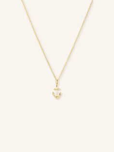 Add a touch of nautical charm to your jewelry collection with our Gold Anchor Necklace. Made with high-quality gold, this necklace features a delicate anchor charm that symbolizes strength and stability. Perfect for everyday wear or a special occasion. Elegant Yellow Gold Anchor-shaped Necklaces, Yellow Gold Nautical Anchor Jewelry, 14k Gold Anchor Necklace Gift, 14k Gold Anchor Necklace As Gift, Anchor Pendant, Anchor Charm, Anchor Necklace, Jewelry Cleaner, Exquisite Jewelry