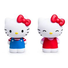 two hello kitty figurines sitting next to each other