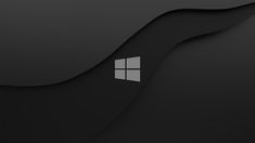 the windows logo is shown in this black and white photo, with wavy shapes behind it