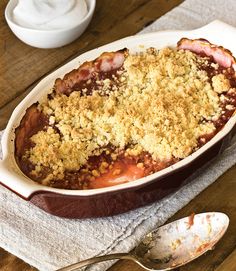 a casserole dish filled with meat and crumbled toppings on top