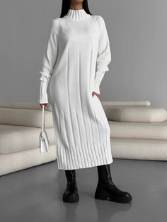 "White knitted midi dress made from premium merino yarn and cotton will keep you warm in cold weather and keep you looking elegant!  Our turtleneck dress with high cuffs and a knit pattern is suitable for a variety of occasions, a holiday party, a romantic date or a stylish casual look for every day.   DETAILS  - white  - 50% merino wool, 50 % cotton  - midi - loose fit - turtleneck  - high cuff - cozy  - warm   SIZES     This dress is available in 2 sizes S-M and L-XL   S-M  BUST up to 39\"/ 100 cm  WAIST to 39\"/ 100 cm  HIPS up to 39\"/ 100 cm  L - XL   BUST up to 43.3\"/ 110 cm  WAIST to 43.3\"/ 110 cm  HIPS up to 43.3\"/ 110 cm More selection of dresses and other clothes here https://www.etsy.com/uk/shop/ElenaKosminskaya SHIPPING Standard shipping (14-30 days) is FREE for you. Worldwi Knitted Knee-length Sweater Dress For Winter, Long Ribbed Knit Sweater, Ribbed Turtleneck Winter Dress, Winter Knee-length Knit Sweater Dress, Knee-length Knit Sweater Dress For Winter, Elegant White Cable Knit Dress, Casual Midi Length Winter Sweater, Casual Midi-length Winter Sweater, Long Ribbed Winter Sweater