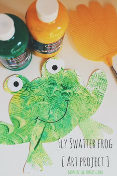 a paper frog craft with glue on it