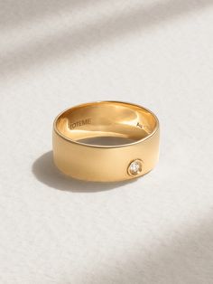 TOTEME's ring is so timeless in its simplicity. It's crafted from 18-karat gold with a wide band and bezel-set with a petite diamond for a touch of sparkle. Wear it solo on your middle or index finger. Winter Work Wear, Cold Weather Boots, Index Finger, Raffia Bag, Gold Diamond Ring, Loafer Mules, Fine Jewelry Designers, Gold Diamond Rings, Wide Bands