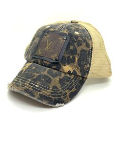 A - Arabian Leopard with Cream Mesh Backing Black/Black Distressed Flat Brim Hat With Adjustable Fit, Distressed Adjustable Flat Brim Hat, Black Distressed Hat With Curved Brim, Adjustable Brown Trucker Hat With Short Brim, Black Distressed Adjustable Hat, Distressed Visor Hat, One Size Fits Most, Black Adjustable Distressed Hat, Brown Flat Brim Baseball Cap, One Size Fits Most, Brown Flat Brim Baseball Cap One Size