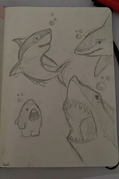 a drawing of two sharks and one fish