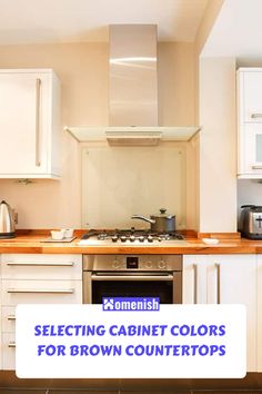 a kitchen with white cabinets and wooden counter tops, including an oven top stove hood