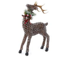 a christmas ornament with a deer and pine cones on its antlers