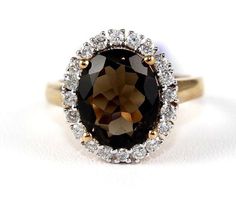 This is a Fine Natural Oval Smokey Brown Topaz & Diamond Solitaire Ring. It is made of 100% natural 14kt rose gold and is in Brand New Condition. It has a CTW of 4.67Ct (.57 Diamond/ 4.10 Smoky Quartz) and weighs 4.9 grams. The fine diamonds have a clarity of SI3 and J color. This beautiful custom piece has an excellent round cut brown smokey topaz stone, surrounded by a diamond halo. It comes with a bright shine polish finish and has good workmanship. Samson Diamond 100% authentic natural Diamonds, Gemstones, and Gold. Never lab created/synthetic/fake merchandise.  CUSTOM ORDERS i.  We offer FREE sizing on all of our rings so please put in a request before purchasing.  ii.  Most rings come in a standard US size 7 in lady's rings and US size 11 in men's rings.  iii.  If we change the size Brown Smokey, Brown Gemstone, Smokey Topaz, Diamond Solitaire Ring, Topaz Stone, Stone Engagement Rings, Diamond Solitaire Rings, Finger Ring, Men's Rings