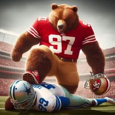 a large brown bear standing next to a football player