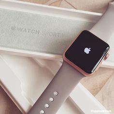 an apple watch sitting on top of a box