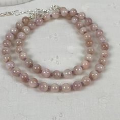 Pink Amethyst Spiritual Necklaces, Pink Amethyst Spiritual Necklace, Elegant Pink Necklaces With 8mm Beads, Adjustable Rose Quartz Round Bead Necklace, Rose Quartz Beaded Necklaces For Gift, Adjustable Rose Quartz Necklace With Round Beads, Dainty Pink Round Bead Crystal Necklaces, Dainty Hand-strung Necklaces With Round Beads, Pink Hand-strung Amethyst Jewelry