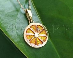 Brass Lemon PendantMaterial: • Brass, Acrylic enamel.Color:•Green •Yellow •Orange •RedSize: 0.79 in. or 20 mm.The chain is not included•Lemons are a hybrid between a sour orange and a citron.•Lemons are rich in vitamin C.•Lemons trees can produce up to 600lbs or 270kg of lemons every year.•Lemon trees produce fruit all year round.•Lemon zest, grated rinds, is often used in baking.•Lemon tree leaves can be used to make tea.•The high acidity of lemons make them good cleaning aids.•The most common Yellow Sterling Silver Charms Jewelry, Sterling Silver Yellow Charms Jewelry, Nickel-free Yellow Round Pendant Jewelry, Yellow Locket Jewelry For Gift, Yellow Locket Jewelry As Gift, Orange Charm Jewelry For Gifts, Orange Jewelry With Lobster Clasp For Gift, Orange Pendant Jewelry For Wedding, Yellow Pendant Charm Necklace For Gift